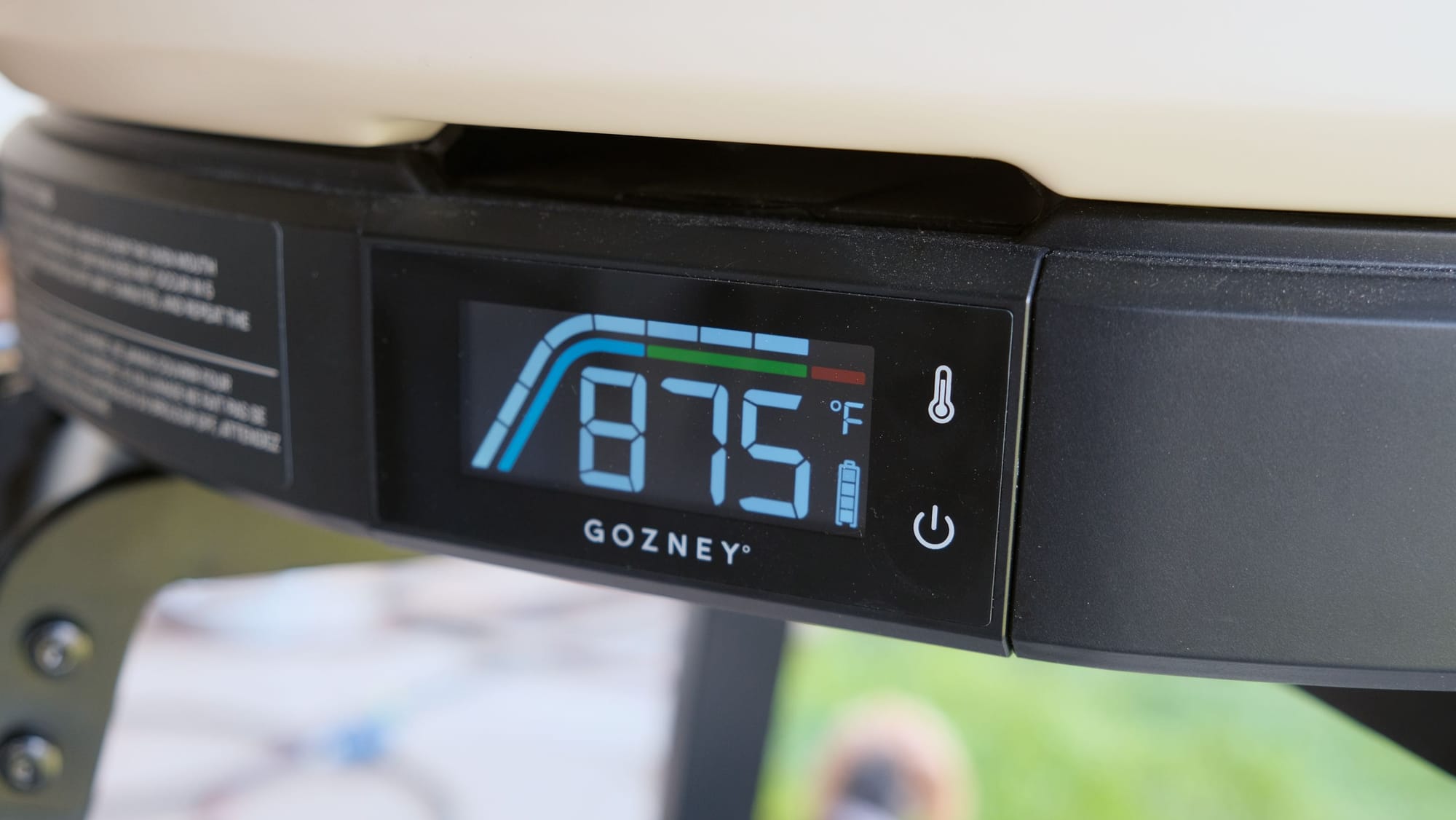 Close-up of the built-in digital thermometer on the Gozney Arc XL reading 875 degrees Fahrenheit.